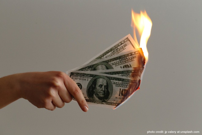 burned-100-us-dollar-banknotes